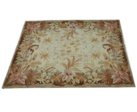 A 1930's Aubusson style tapestry rug, the wide floral foliate border in shades of pinks, 186 by 255cm.