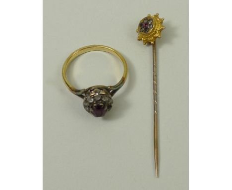 A ruby and diamond ring, size L, together with a 9ct gold and gem set flower head stick pin, 3.6g.
