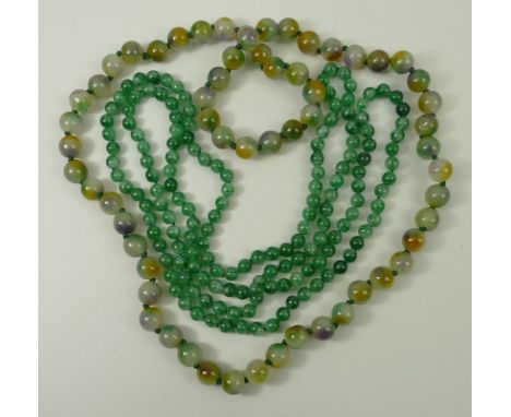A multi-tonal jade bead necklace, the pale beads streaked with pale green, violet and umber, and a further necklace of apple/
