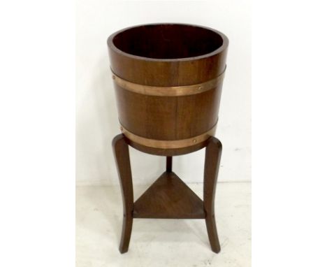 An early 20th century copper bound oak planter, R. D. Lister & Co Ltd, 33 by 68cm high.