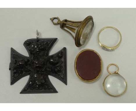 An 18ct gold, platinum and diamond three stone ring in a cross over setting, size O, 1.9g, a Georgian rock crystal intaglio f