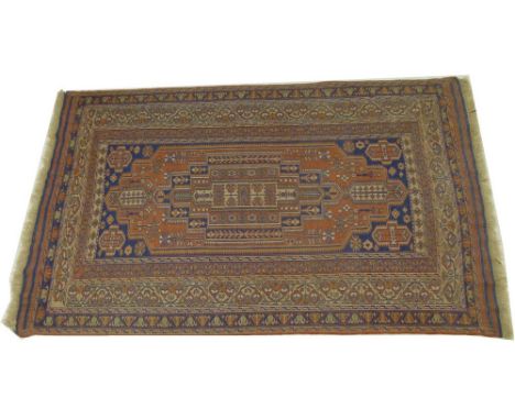 A Northern Persian / Iranian flat weave carpet with central medallion, navy motifs on a terracotta ground, 152 by 252cm.