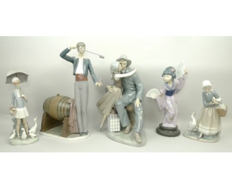 A Lladro porcelain figure of a wine taster, 36cm high, another of a seaman and girl with lantern, 32cm high, a Japanese girl,