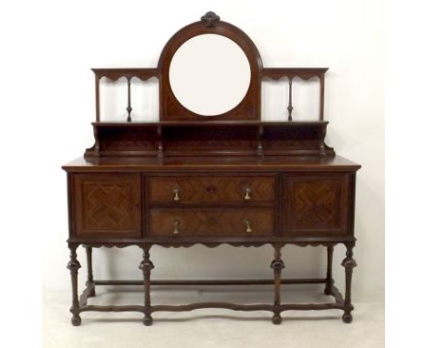 An Edwardian mahogany and inlaid mirror backed sideboard, the circular bevelled mirror with open gallery and single shelf ove