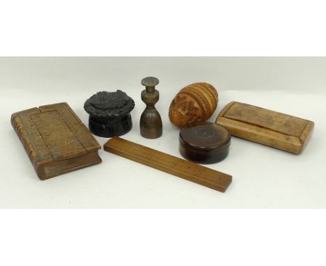 A group of treen, comprising; a yew wood snuff box engraved Mary Riches to the lid, a hat measure rule, a seal, a chip carved