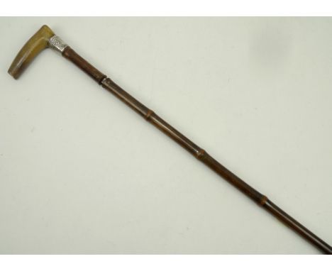 A 19th century horn and bamboo sword stick with white metal ferrule, 88cm long. 