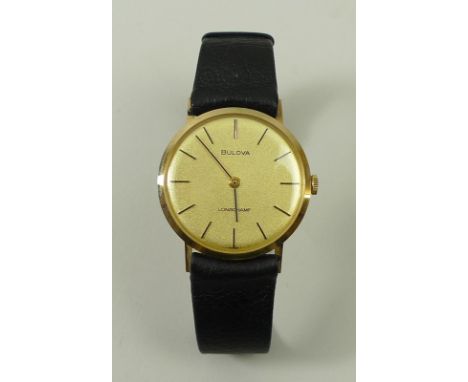 A Bulover Longchamp gentleman's circular cased manual wind wristwatch with batons on a plain gold coloured dial with leather 