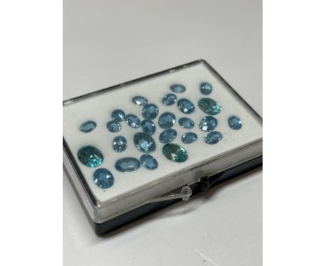 14.91cts of light blue oval cut stones in various sizes