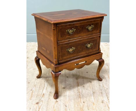 A yew wood inlaid drinks cabinet with hinged lift up top enclosing a fitted interior with slide-out glass section fitted with