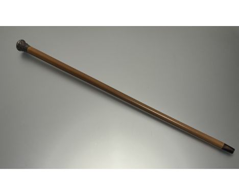 A late 19thc Thai white metal mounted mallaca walking stick with cased top an engraved initials R C W depicting a farmer with