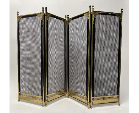 A brass and grilling four panel fireplace spark guard, with pierced brass panel to base and embossed brass corner decoration 