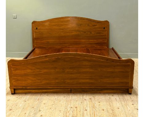 A Chinese hardwood and cherry wood super king bed, complete with three drawers and lift-up panel tops to pair of bases with r