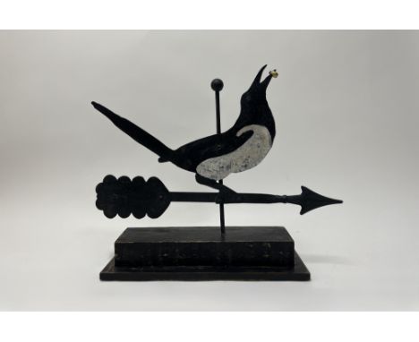 Ramsay Gillies, a contemporary Folk Art inspired weather vane of a painted sheet metal magpie with a brass ring, raised on a 
