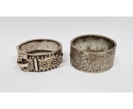 Victorian silver buckle pattern bangle and another white metal bangle, foliate engraved (2)&nbsp;