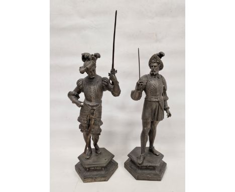 Pair of late 19th/early 20th century French spelter figures of soldiers in historical costume, each holding a sword, standing