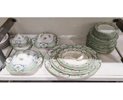 Early-mid 20th century Wedgwood pottery Louvre pattern part dinner service, printed and painted with vignettes of flower spra