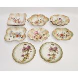 A Carlton Ware blush ivory ground part dessert service, printed marks, all with floral decoration (