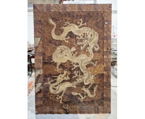 Large Japanese embroidered silk and cotton panel, circa 1930, depicting four scrolling three-clawed dragons amongst brown clo