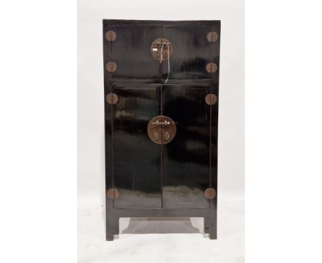 Late 19th/early 20th century Chinese black lacquered cabinet,&nbsp;comprising a two-door section to the top opening to reveal