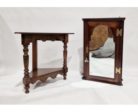 Victorian mahogany wall hanging corner cupboard, the single mirrored door opening to reveal four shelves, the door itself wit