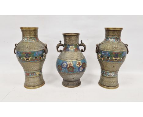 A garniture of three Chinese or Japanese cloisonne enamel vases, late 19th/early 20th century, each of baluster form two with