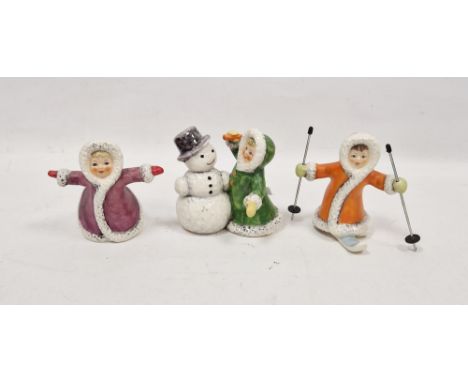 Three Goebel pottery figures emblematic of Winter, printed blue marks, painted and impressed numerals, comprising a figure on