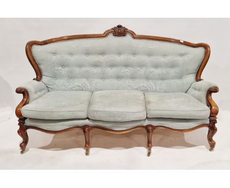 Victorian walnut-framed button back&nbsp;salon suite, comprising a three-seater sofa and a pair of armchairs, upholstered in 