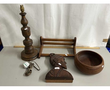 An oak table lamp together with a further book rack, circular bowl and a carved wood bust