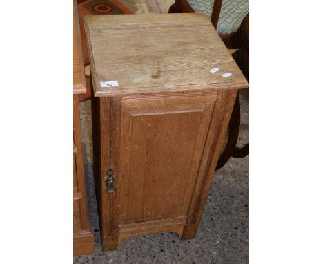 Late Victorian light oak single door bedside cabinet