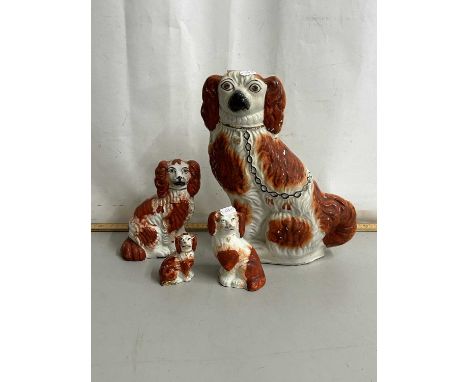Group of four Staffordshire model Spaniels
