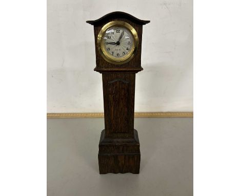 A miniature oak long case clock, 32cm high