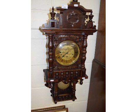 20th Century  oak cased wall clock with brass movement striking on rods