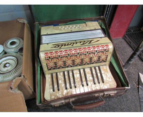 A leather cased Vissimio accordion 