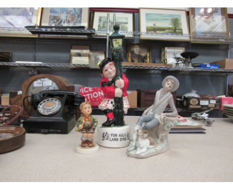 An Auld Lang Syne ceramic musical whisky container together with a Goebel figure of a boy and a Lladro figural scene of a lad