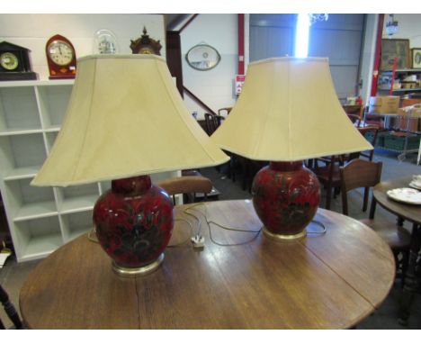 A pair of red ceramic bulbous body table lamps 