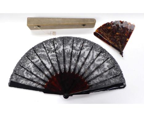 Late 19th Century Large Black Lace Fan, on tortoiseshell sticks, the tortoiseshell continuing to the top of the fan as leaf s