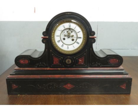 A large 20th century slate mantel clock inlaid with a red marble and an eight day movement