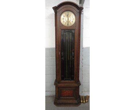 A 20th century chain driven longcase clock in an oak and walnut case, with a brass face, with key