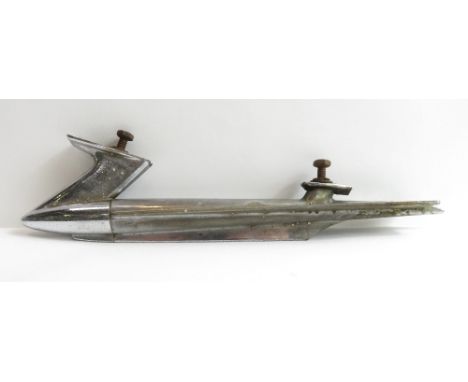 A vintage chromed torpedo shaped car mascot and another in the form of a woman