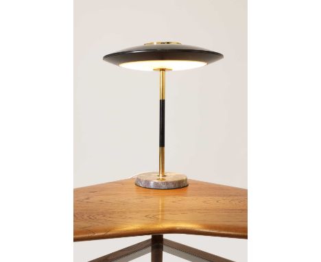 An Italian modernist table lamp,  1950s, by Stilnovo, the flat disc-shaped shade with an opaque Perspex diffuser, raised on a