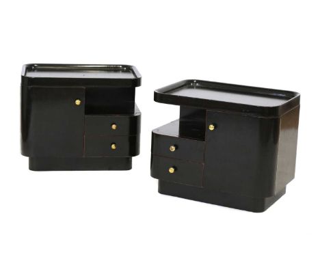 A pair of German Art Deco mahogany bedside tables,each with a dished top, over a shelf and two drawers, with brass handles, 5