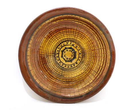 * David Leach (1911-2005),a stoneware charger, with radiating combed decoration, impressed artist's mark,40cm diameterConditi