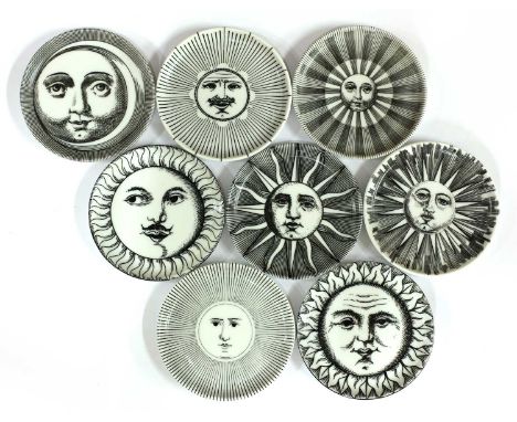 A set of eight Italian 'Soli e Lune' ceramic coasters,1960s, designed by Piero Fornasetti, each decorated with different vari