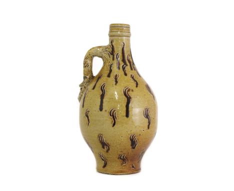 An R W Martin stoneware 'bellarmine' bottle, c.1880, of tapering form with incised 'squiggle' details, the handle with a mask