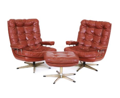 A pair of Danish leather lounge chairs and an ottoman,1970s, all with revolving stands, chairs 77cm wide90cm deep90cm high, s