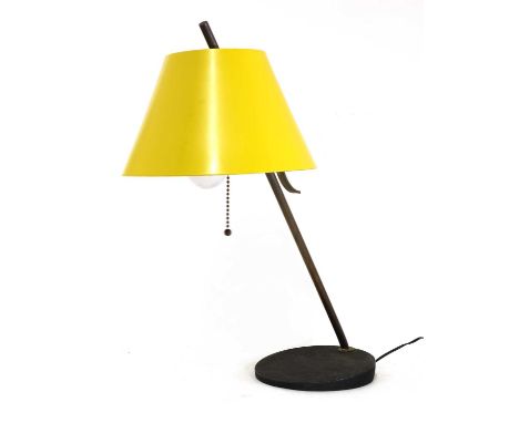 An Italian brass and enamelled desk lamp,1950s, in the manner of Arteluce, with an adjustable yellow shade, fitted with a pul