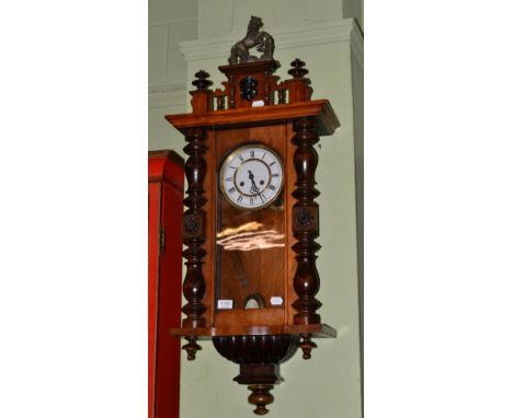 A Vienna style wall clock, Roman enamel dial, twin brass movement, architectural pediment with finial in the form of a horse