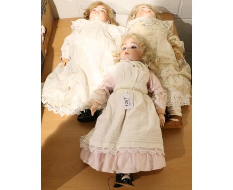 German bisque socket head doll impressed 394, with blond wig, pierced ears, open mouth, sleeping blue eyes, composition joint