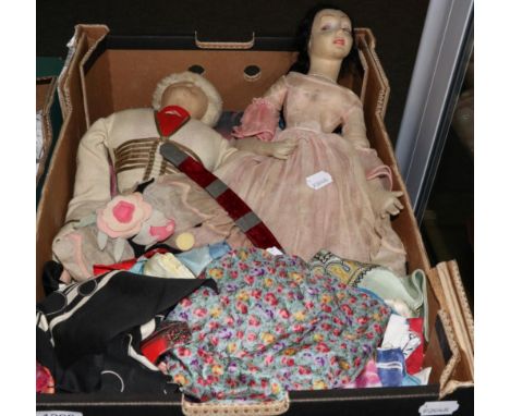 Circa 1920s Boudoir doll wearing a pale pink gauze dress, appliqued with felt flowers, 60cm, a similar figure of a cossack wi