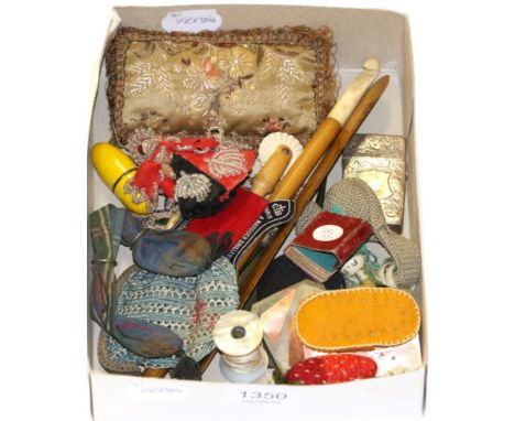 Assorted sewing accessories, pin cushions, crochet hook, miniature wooden doll with bead decoration, blue ribbon small hinged